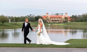 A bride and groom walking and holding hands