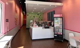 The inside of the the shop is decorated with bright pink walls