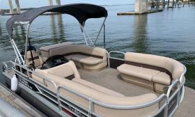 A 10-passenger pontoon boat available for rent at Beaches Marina Rentals