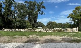 A coquina wall from the lake onsite