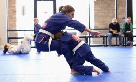 A child using martial arts skills to defend himself against his opponent