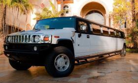 A white hummer limousine parked