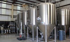 Large steel brewing vats at a local brewery and pub