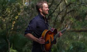 The musician posing with his guitar