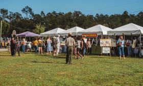 Festival attendees brows various tent booths at the Gullah Geechee Festival at Armstrong Park