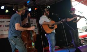 Musicians performing at the Jimmy Jam BBQ Slam's main stage