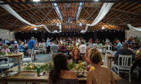 Guests seated at banquet tables at The Venue at Historic Stanton Ford in Hastings, Florida