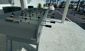 A foosball game on a deck at Ocean Sands Inn