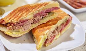 A Cuban sandwich served on a plate