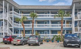 The entry courtyard and parking at the three-story Saint Augustine Beach Hotel