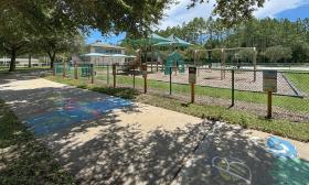 A wrap around sidewalk and playground