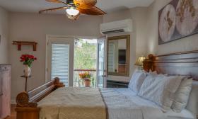 This guest room has a hot tub and a private deck 