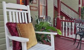 Rocking chairs and bistro tables allow guests to enjoy St. Augustine from the porch