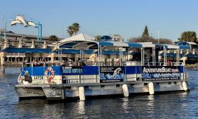 The Adventure Boats Tour taking off from the dock