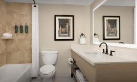 This bathroom in one of the guest rooms, as an expansive counter surrounding the sink