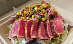 A poke bowl topped with ahi tuna