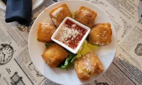 Fried ravioli with marinara sauce in the middle