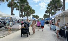 Visitors glancing at the different vendor's tents