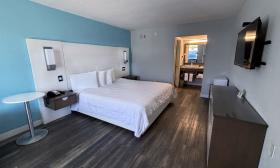 A room with one king-size bed at a hotel on St. Augustine Beach