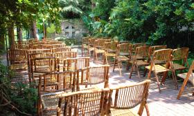 Wood chairs arranged for a wedding at the Pedro Sanchez House