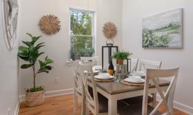 This in-town vacation rental has a charming diningroom, with views of the greenery