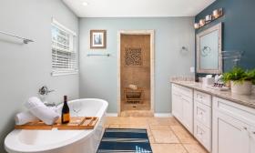 This vacation rental in a beach community offers a master bath suitable for a long soak