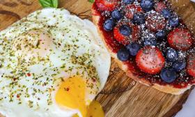 Breakfast purists will enjoy two eggs over easy served with fresh fruit, here with strawberries and blueberries