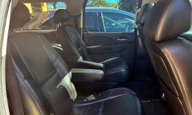 The interior of a vehicle with fine, leather seats