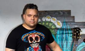 Face shot of guitarist Edwin Barbosa in black t-shirt