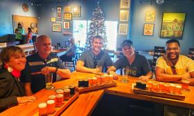 Visitors on a food and drink tour sample beer at Dog Rose