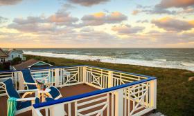 A private deck at a suite at Beachcomber Cottages overlooks the ocean