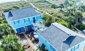 These two cottages are bright blue in color and right off the beach