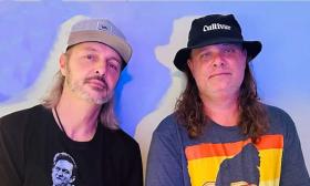 Music duo chuck & Eliot headshot, both wearig hats