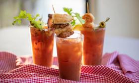 Various Bloody Mary drinks with garnishes