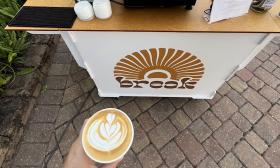 A latte served from the mobile cart