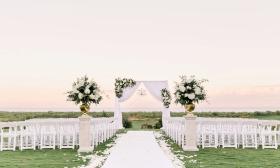 The lawn at Hammock Beach Resort, with chairs and decor ready for a wedding.