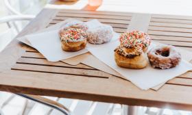 Decorated donuts placed on napkins