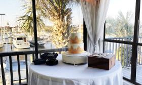 Wedding cake table situated in the HarborView Banquet Room above the Kingfish Grill