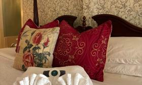 A bed ready for guests at Old Powder House Inn Bed and Breakfast