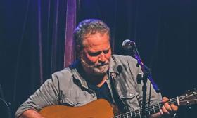 Marc Douglas Berardo, musician onstage with his guitar