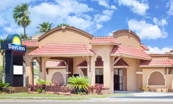 Days Inn by Wyndham in St. Augustine on a sunny day with fluffy clouds in the sky