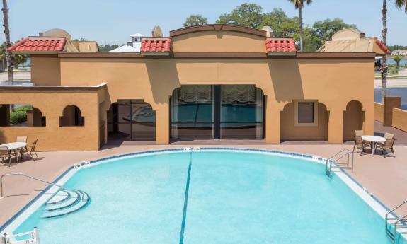 The pool at this hotel on Ponce de Leon Boulevard has a large patio with chairs and tables