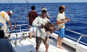 A man holding a fresh caught fish