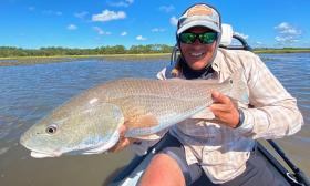 A guest with a fish caught onboard