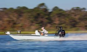 Captain Tommy driving the boat in top speed