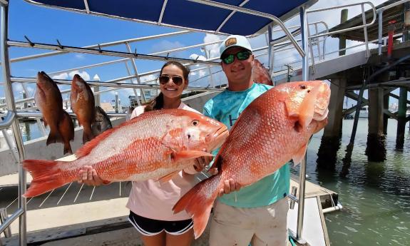 Red snapper being held up