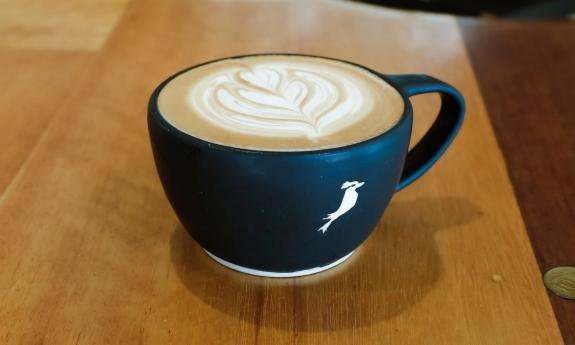 A hot latte with an artistic design