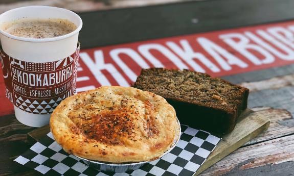 An Aussie pie, bread, and a cup of coffee