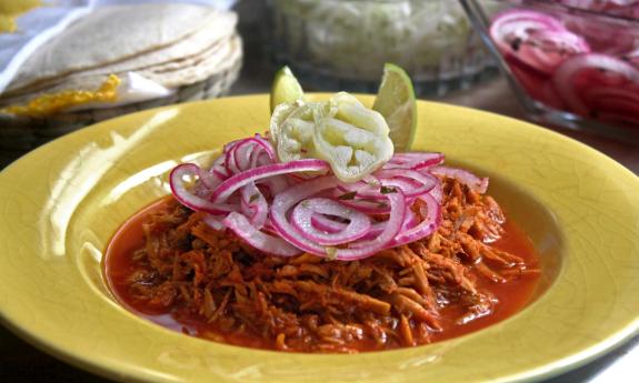 Cochinita pibil (slow roasted citrusy pork) with toppings