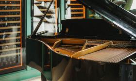 A grand piano set up at the restaurant